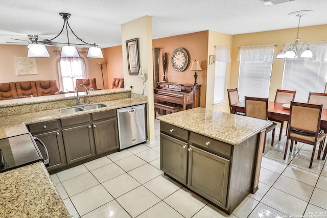 kitchen with ceiling fan with notable chandelier, dishwasher, pendant lighting, dark brown cabinets, and sink