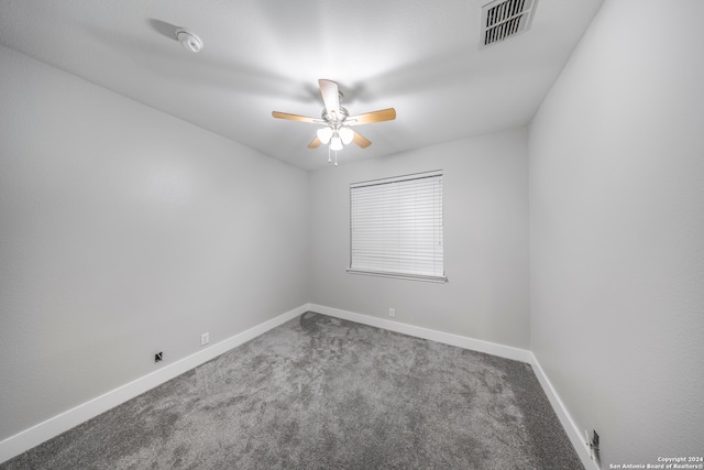 spare room with carpet floors and ceiling fan