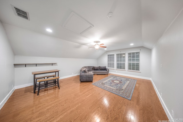 interior space with vaulted ceiling, light wood-type flooring, and ceiling fan