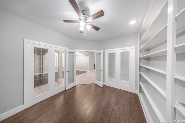 interior space featuring ceiling fan, french doors, and dark hardwood / wood-style flooring