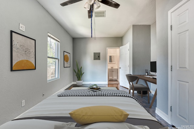 bedroom with connected bathroom, ceiling fan, and hardwood / wood-style flooring