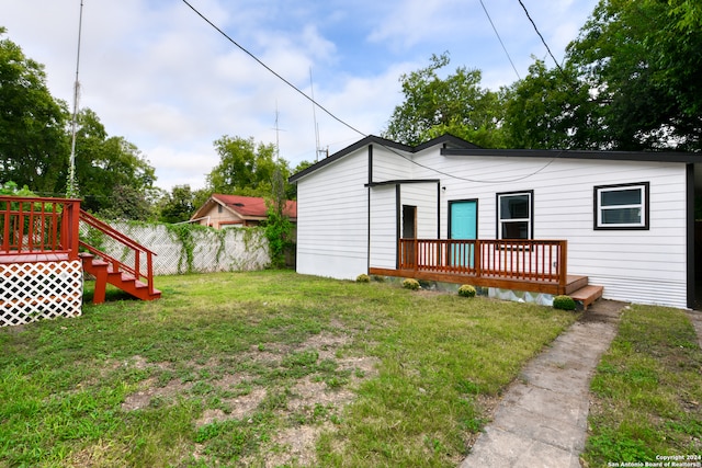 view of yard featuring a wooden deck