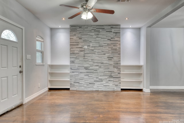 foyer entrance with wood-type flooring and ceiling fan