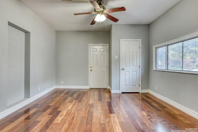 spare room featuring ceiling fan and hardwood / wood-style flooring