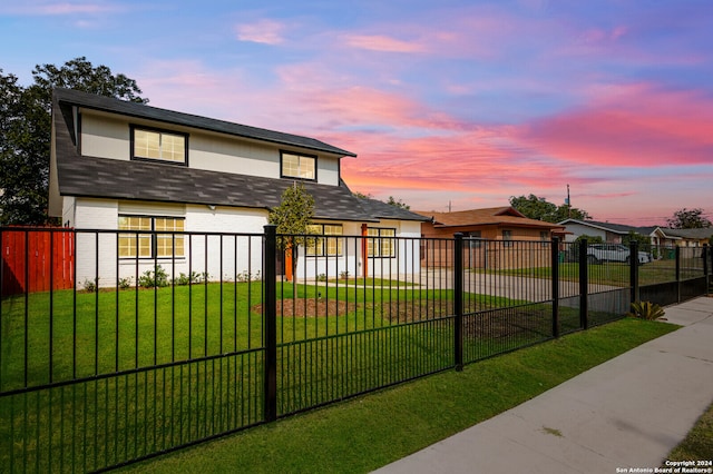 view of front of home with a yard