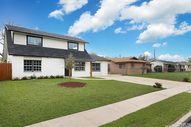 view of front of home with a front lawn