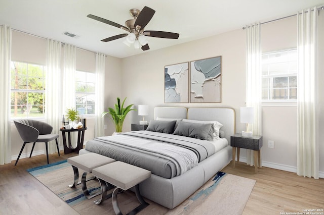 bedroom with ceiling fan and light wood-type flooring