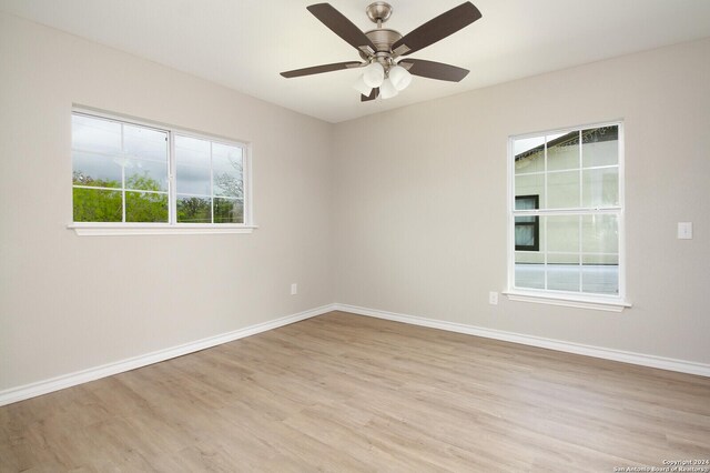 439 Susanwood Dr, San Antonio, TX 78220 - unfurnished room featuring ceiling fan, baseboards, and light wood-style flooring