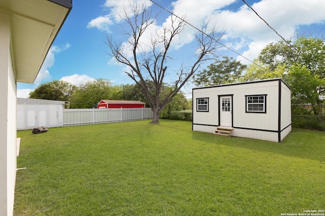 439 Susanwood Dr, San Antonio, TX 78220 - view of yard with an outdoor structure, a fenced backyard, and entry steps