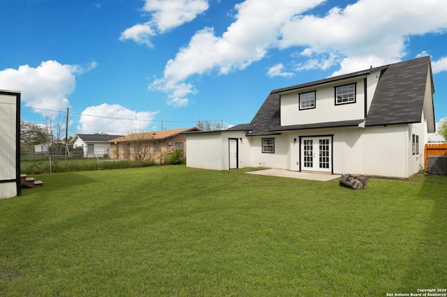 439 Susanwood Dr, San Antonio, TX 78220 - back of property featuring a shingled roof, french doors, fence, and a lawn