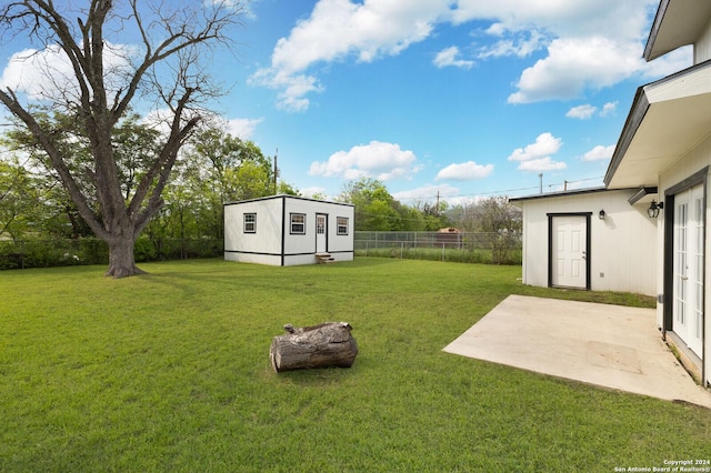 439 Susanwood Dr, San Antonio, TX 78220 - view of yard with an outbuilding, a patio area, french doors, and a fenced backyard