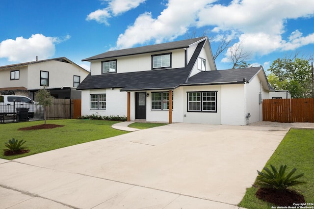 439 Susanwood Dr, San Antonio, TX 78220 - view of front facade with concrete driveway, fence, a front lawn, and roof with shingles