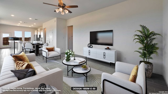 living room with ceiling fan and wood-type flooring