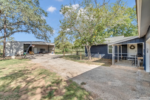 view of yard with an outdoor structure and a garage