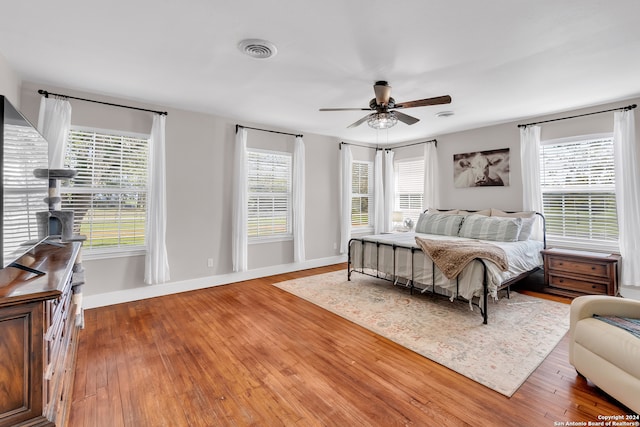 bedroom featuring ceiling fan and wood-type flooring