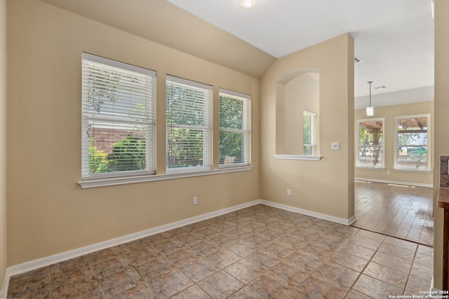 empty room featuring light hardwood / wood-style flooring and a wealth of natural light