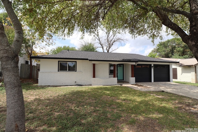 single story home with brick siding, concrete driveway, a front yard, fence, and a garage