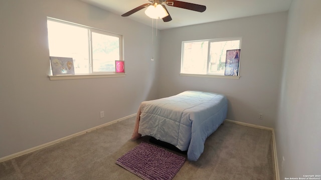 bedroom with ceiling fan and carpet