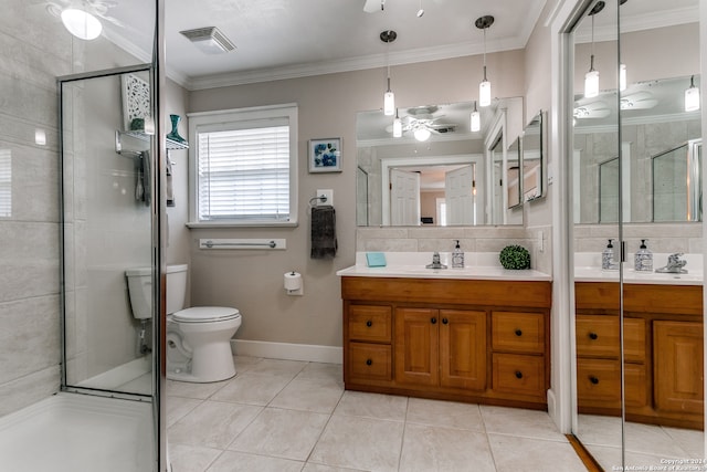 bathroom featuring ceiling fan, vanity, backsplash, toilet, and a shower with door