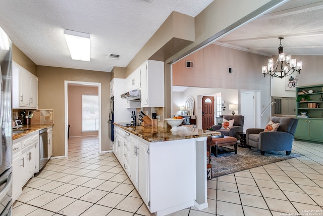 kitchen featuring dishwasher, a textured ceiling, white cabinetry, kitchen peninsula, and dark stone countertops