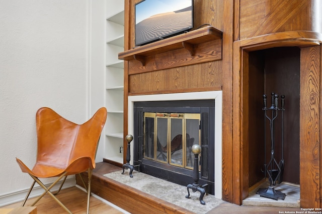 sitting room featuring hardwood / wood-style floors