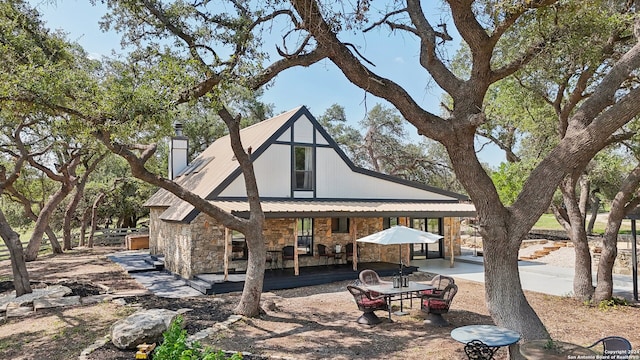 back of house with a patio area