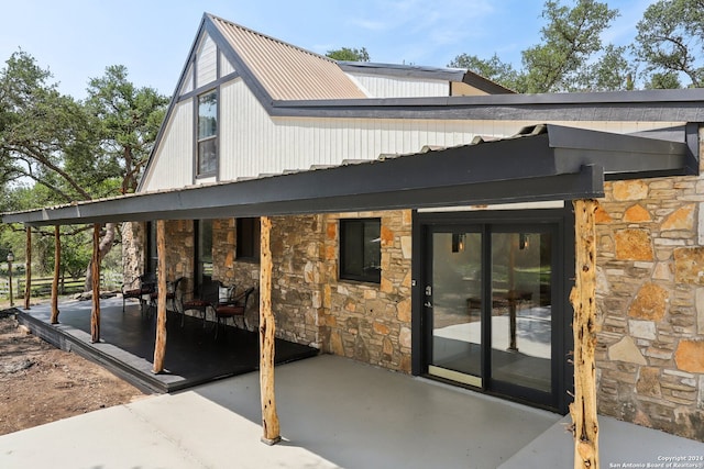 rear view of property featuring a patio