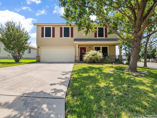 view of front facade with a garage and a front lawn