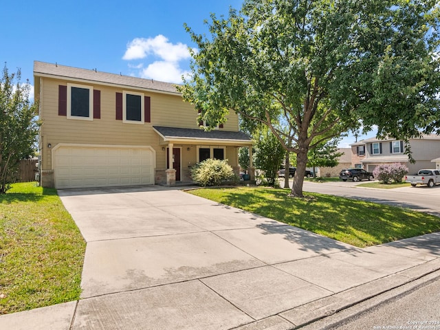 front of property featuring a front yard and a garage