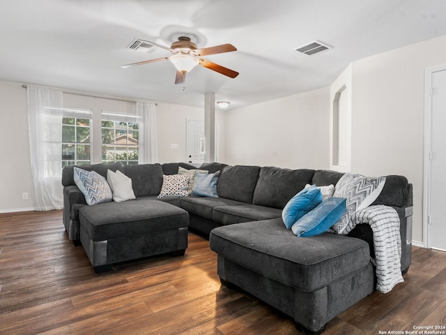 living room featuring ceiling fan and hardwood / wood-style flooring