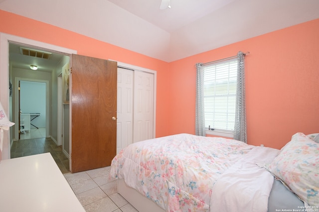 tiled bedroom with a closet and ceiling fan