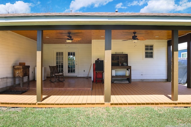 wooden deck featuring ceiling fan