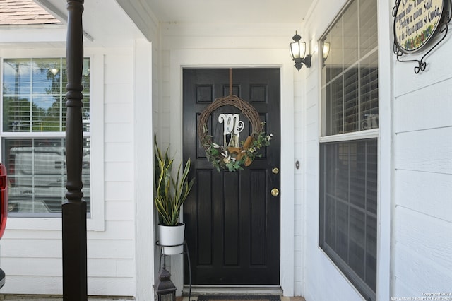 entrance to property with a porch