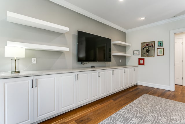 living room with ornamental molding and dark hardwood / wood-style floors