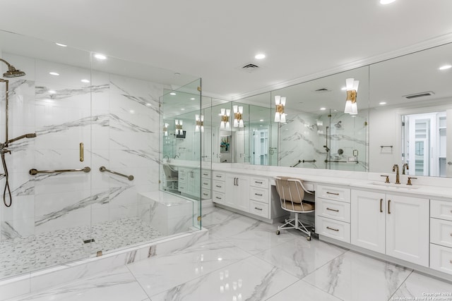 bathroom featuring vanity and an enclosed shower