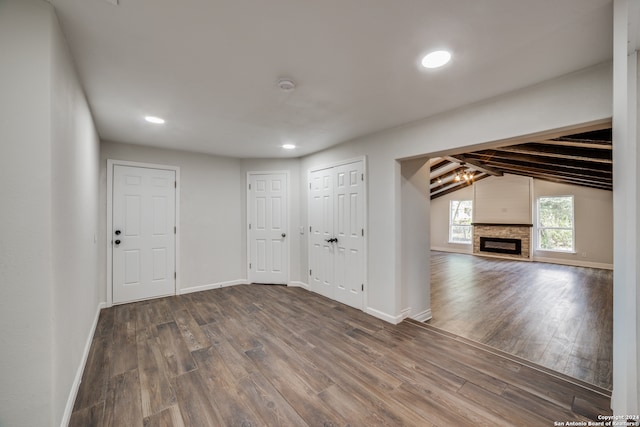 interior space featuring a fireplace and dark hardwood / wood-style floors