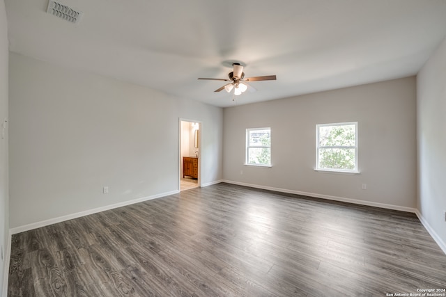 unfurnished room featuring dark hardwood / wood-style floors and ceiling fan