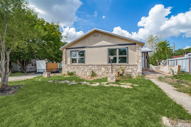 view of front of property with a front lawn