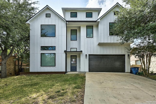 modern farmhouse style home featuring a garage and a front lawn