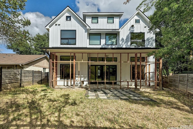 back of house featuring a yard