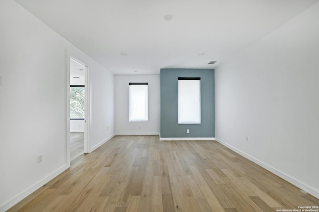 unfurnished room featuring light wood-type flooring