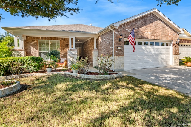 ranch-style house featuring a front yard and a garage