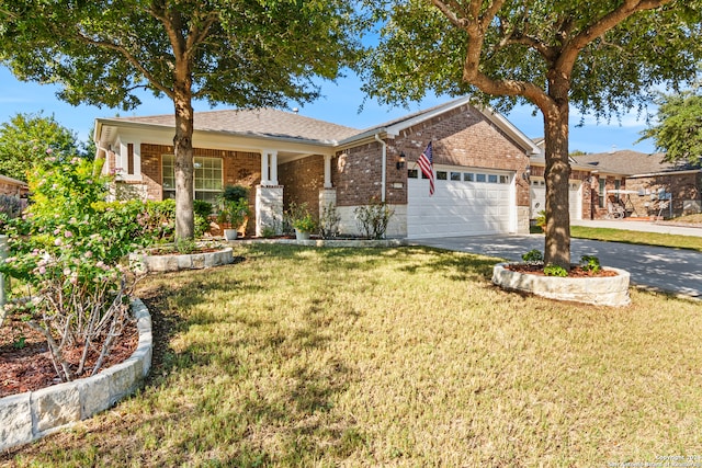 ranch-style house featuring a front yard and a garage