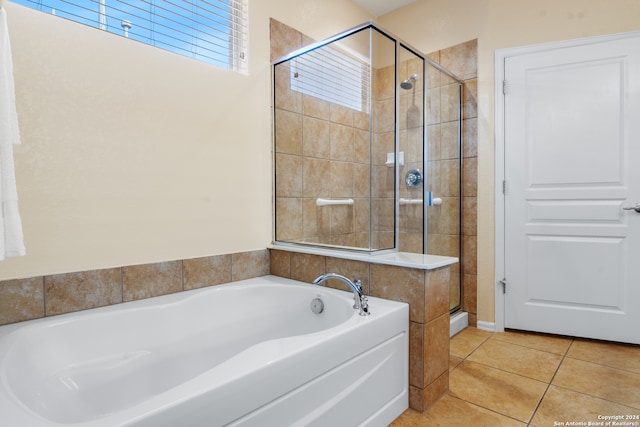 bathroom featuring independent shower and bath and tile patterned floors