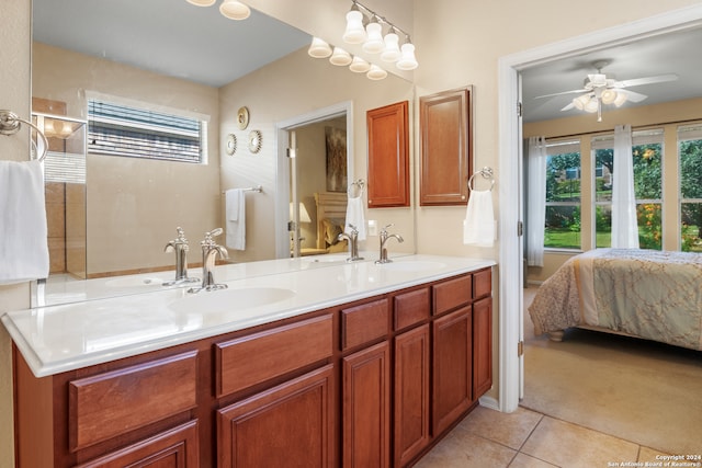 bathroom with ceiling fan, vanity, and tile patterned flooring