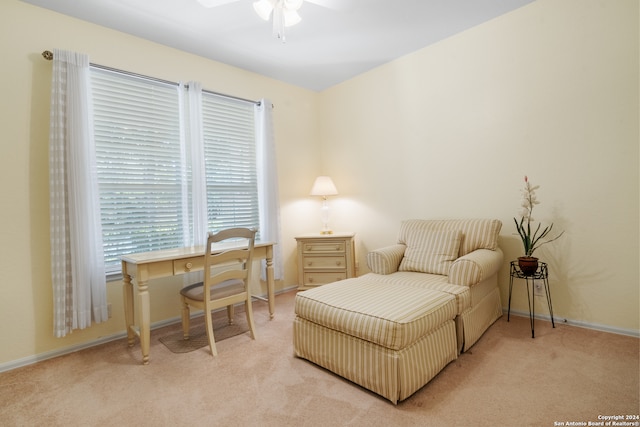 sitting room with carpet and ceiling fan