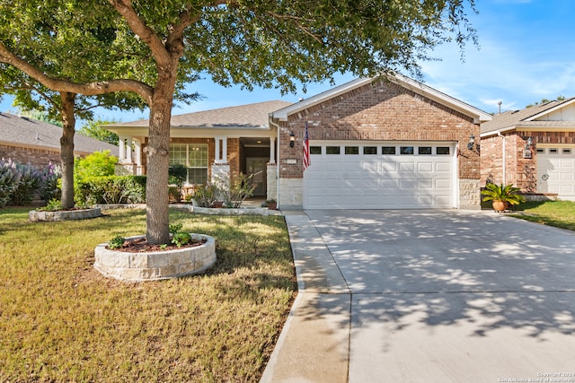 ranch-style house with a garage and a front lawn