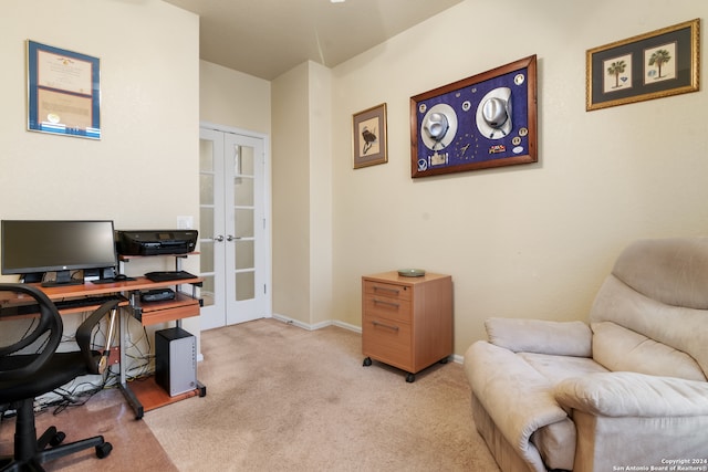 home office with light carpet and french doors