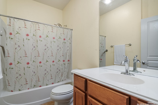 full bathroom with vanity, toilet, and shower / tub combo with curtain