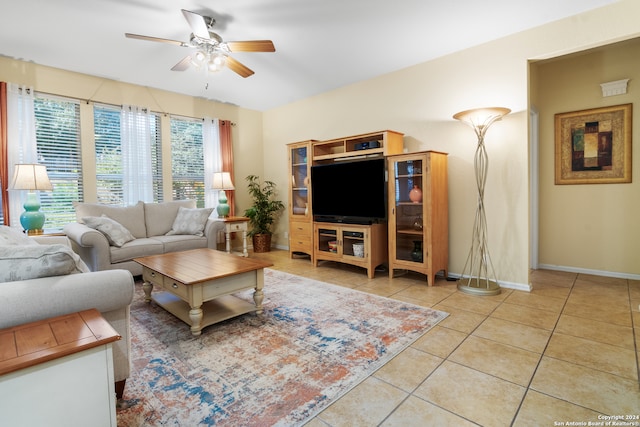 tiled living room with ceiling fan